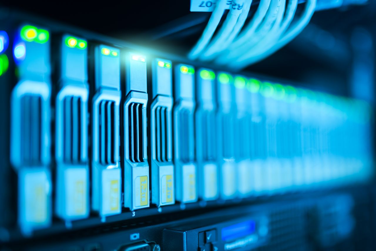 The Art of Drawing Readers In: Your attractive post title goes here Detailed image of a server rack with glowing lights in a modern data center.